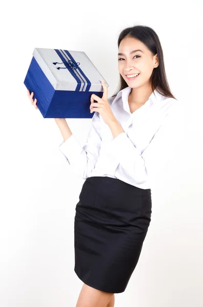 Young business woman holding a gift — Stock Photo, Image