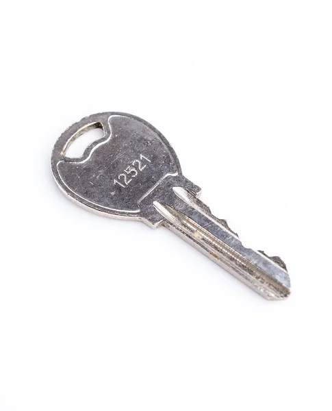 Metal key on isolated white background — Stock Photo, Image