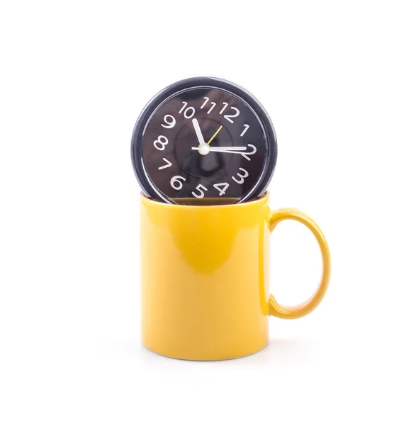 Gelber Becher und Uhr — Stockfoto