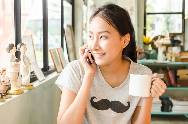 Girl in coffee shop — Stock Photo, Image