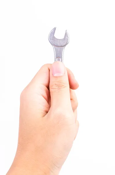 Hand mit Schraubenschlüssel — Stockfoto