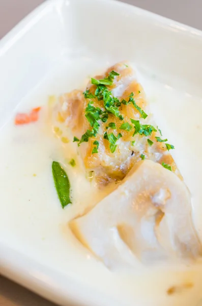 Fish with white sauce and mushroom — Stock Photo, Image