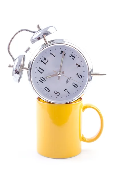 Yellow mug and clock — Stock Photo, Image