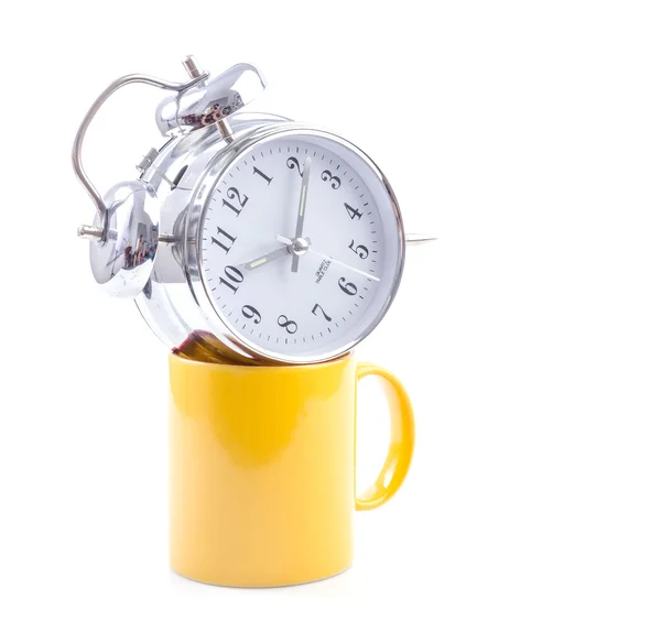 Yellow mug and clock — Stock Photo, Image