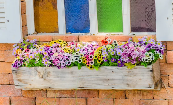 Plastic flowers in vase — Stock Photo, Image