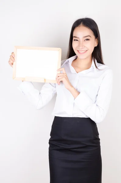 Business woman showing empty board — Stock Photo, Image