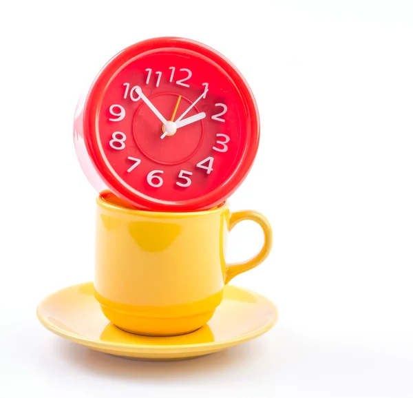 Yellow mug and clock — Stock Photo, Image