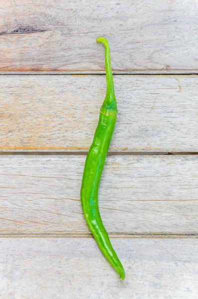 Chilli on wood background — Stock Photo, Image