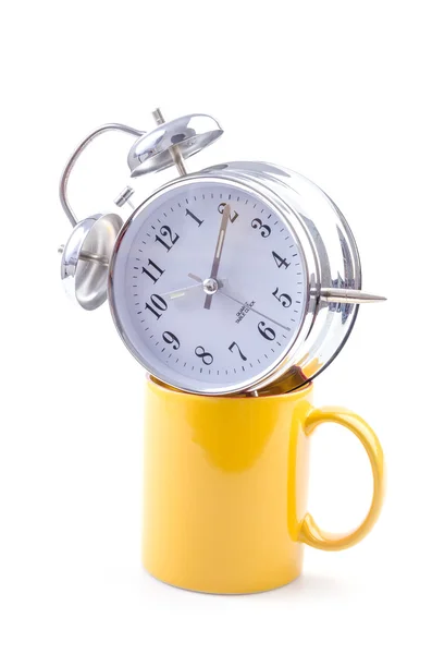 Yellow mug and clock — Stock Photo, Image