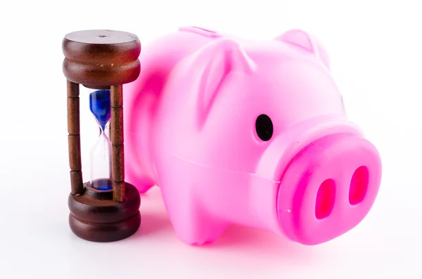 Piggy bank and sand clock — Stock Photo, Image