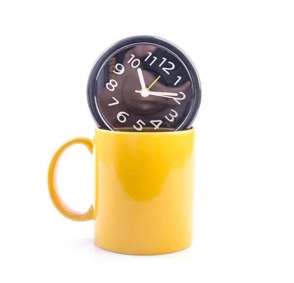 Yellow mug and clock — Stock Photo, Image