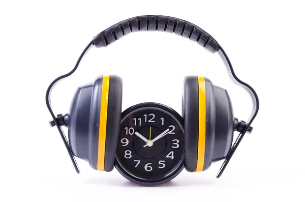 Ear phones and clock — Stock Photo, Image