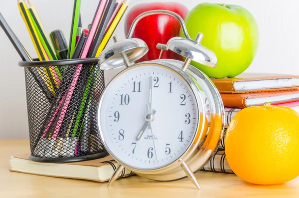 Note book, clock, pencils, apples — Stock Photo, Image