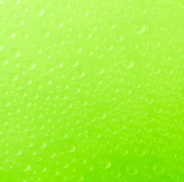 Wassertropfen auf farbigem Hintergrund — Stockfoto