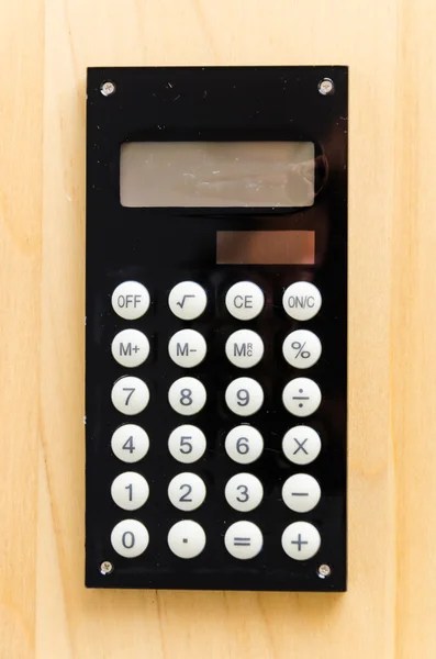 Calculator op houten tafel — Stockfoto