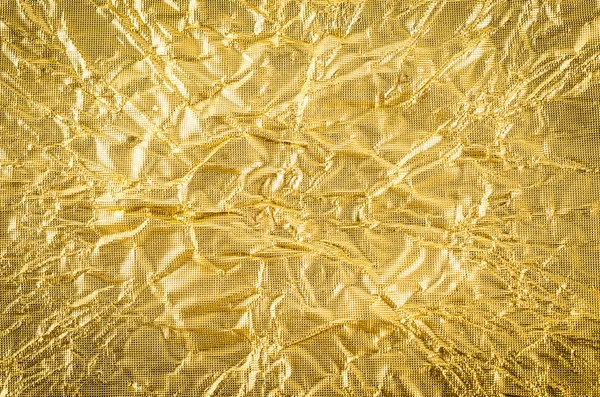 Papel dourado crumpled textura fundo — Fotografia de Stock