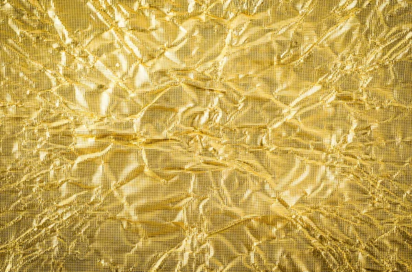 Papel dourado crumpled textura fundo — Fotografia de Stock