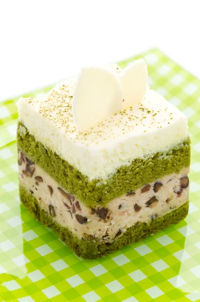 Beyaz arka plan üzerinde izole Matcha yeşil çay pasta