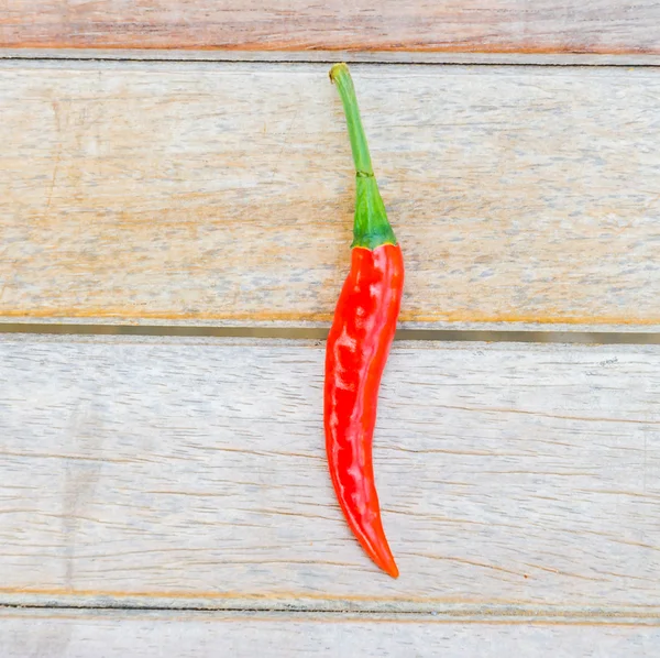 Chilli on wood background — Stock Photo, Image