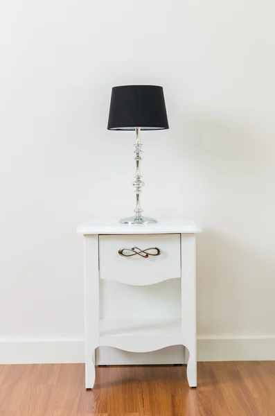 Lamp on bedside table — Stock Photo, Image