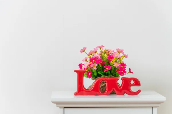 Love sign on bedside table — Stock Photo, Image