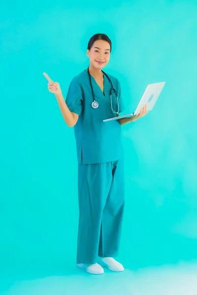 Portrait Beautiful Young Asian Doctor Woman Laptop Computer Blue Isolated — Stock Photo, Image