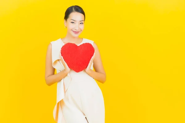 Portrait Beautiful Young Asian Woman Smile Heart Pillow Shape Yellow — Stock Photo, Image
