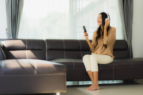 Portrait Beautiful Young Asian Woman Use Smartphone Cellphone Sofa Headphone — Stock Photo, Image