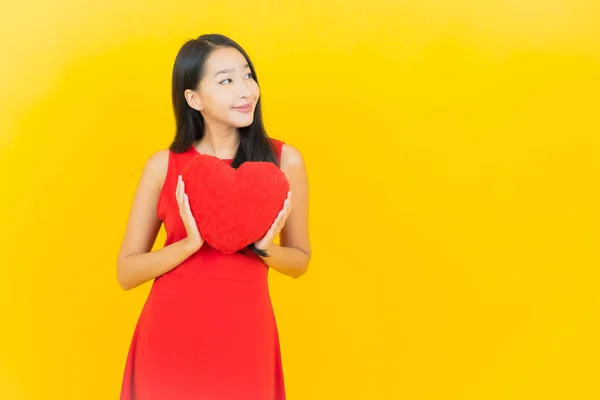 Portrait Beautiful Young Asian Woman Smile Heart Pillow Shape Yellow — Stock Photo, Image