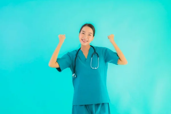 Portrait beautiful young asian doctor woman happy smile for work in hospital and clinic on blue isolated background