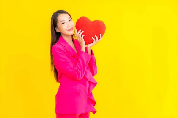 Portrait Beautiful Young Asian Woman Heart Pillow Shape Yellow Isolated — Stock Photo, Image