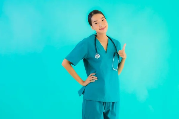 Portrait beautiful young asian doctor woman happy smile for work in hospital and clinic on blue isolated background