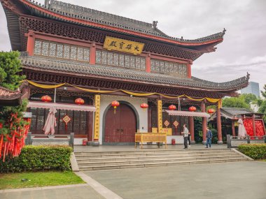 Changsha/China-18 October 2018:Unacquainted people and chinese building on Orange Island Park Changsha city hunan China.changsha is the capital and most populous city of Hunan