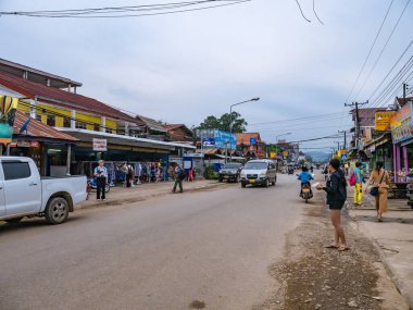 Vangvieng/lao-4 Dec 2017:Unacquainted People walking on vangvieng downtown in Lao.Vangvieng City The famous holiday destination town in Lao.