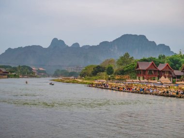 Vangvieng/lao-4 Dec 2017:Beautiful view of nam song river with riverside restaurant and the mountain at Vangvieng city Lao.Vangvieng City The famous holiday destination town in Lao.