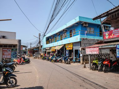 Chonburi/Thailand -21 apr 2019:Unacquainted tourist walking at Downtown of koh larn island Pattaya chonburi city Thailand.Rent motorcycle shop on koh larn island.