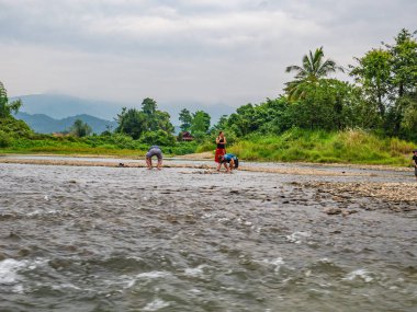 Vangvieng/lao-10 Dec 2017:Unacquainted Local people fishing on namsong river at vangvieng city Laos.Vangvieng City The famous holiday destination town in Lao.