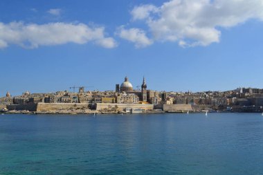 View from above of the golden domes of churches and roofs with church of Our Lady of Mount Carmel and St. Paul's Anglican Pro-Cathedral, Valletta, Capital city of Malta
