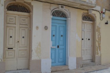Traditional colourful Maltese doors in a resort town on the east coast of the Mediterranean island of Malta.