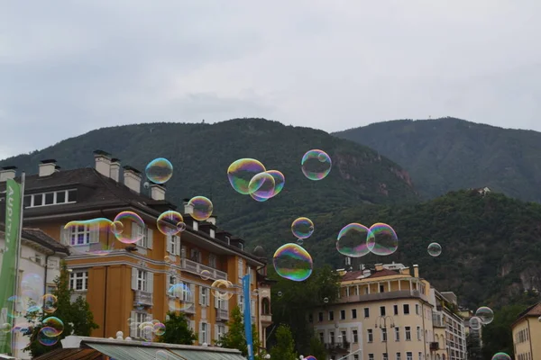 Soap bubbles in the air of Bolzano city , Italy, Europe