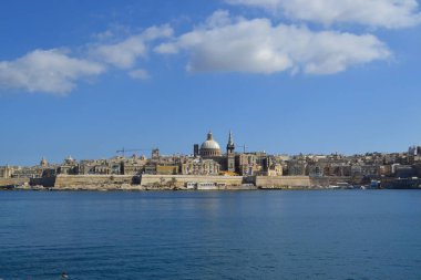 View from above of the golden domes of churches and roofs with church of Our Lady of Mount Carmel and St. Paul's Anglican Pro-Cathedral, Valletta, Capital city of Malta