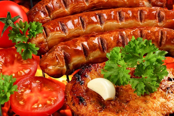 Bbq with sausages and steak — Stock Photo, Image