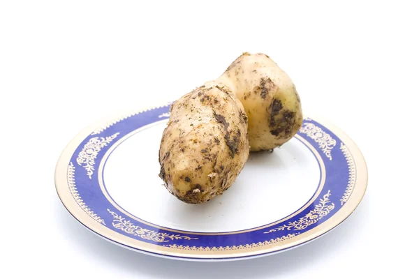 Fresh ziemniak brązowy na talerzu — Zdjęcie stockowe