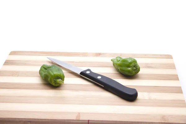 Capsicum with Knife on Wooden Plate — Stock Photo, Image