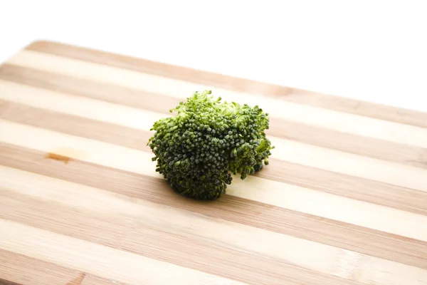 Fresh green Broccoli on wooden plate — Stock Photo, Image