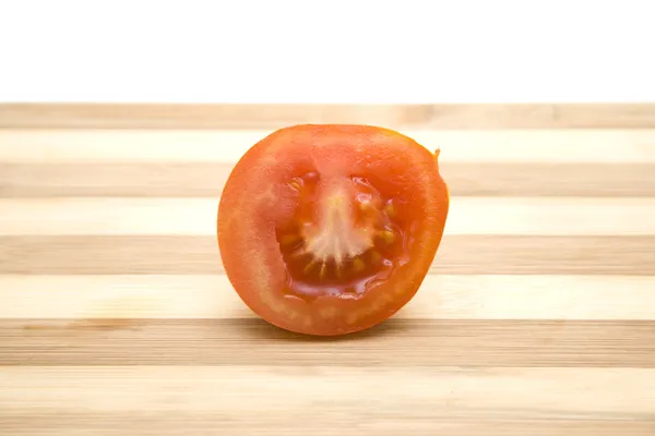 Fresh red Tomato on wooden plate — Stock Photo, Image