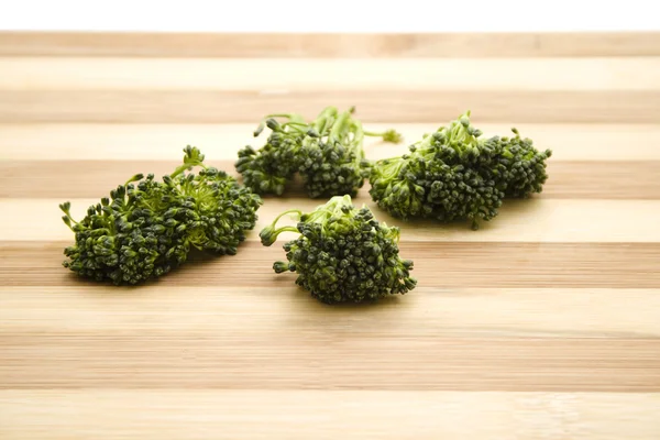 Fresh Green Broccoli on wooden plate — Stock Photo, Image