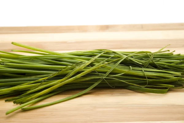Fresh Green Chives on Wooden plate — Stock Photo, Image