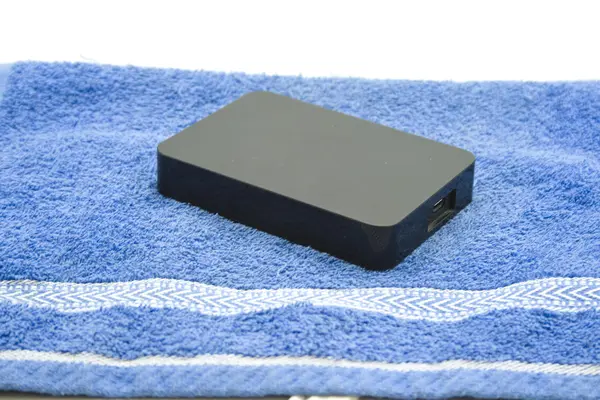 External Hard disk drive on blue Towel — Stock Photo, Image