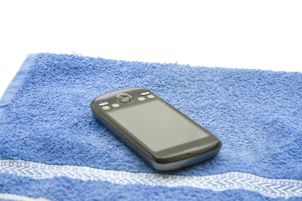 Smartphone på blå handduk — Stockfoto